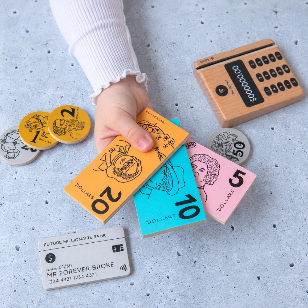 Make Me Iconic Iconic Australian Money & Point of Sale Machine wooden toy set for kids, with POS machine, credit card, Aussie banknotes and coins for imaginative shop role play and early maths learning.