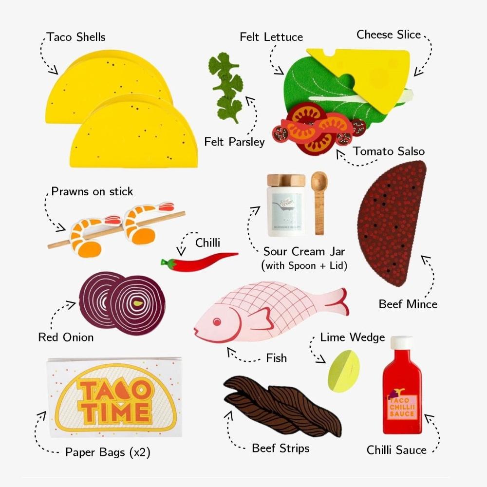 Make Me Iconic 21-piece wooden toy play Taco Kit featuring stand-up taco shells, prawns on skewers, paper takeaway bags, felt toppings, and pretend condiments like chilli sauce and sour cream for imaginative role play.