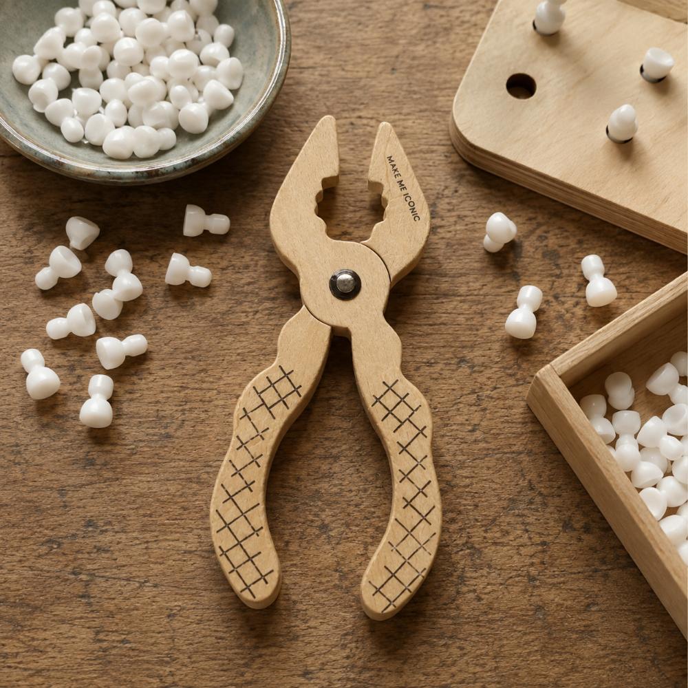 Make Me Iconic Iconic Pliers wood tool toy for kids, a durable wooden pretend play tool designed for little hands, imaginative builder play, construction role play and screen-free play.