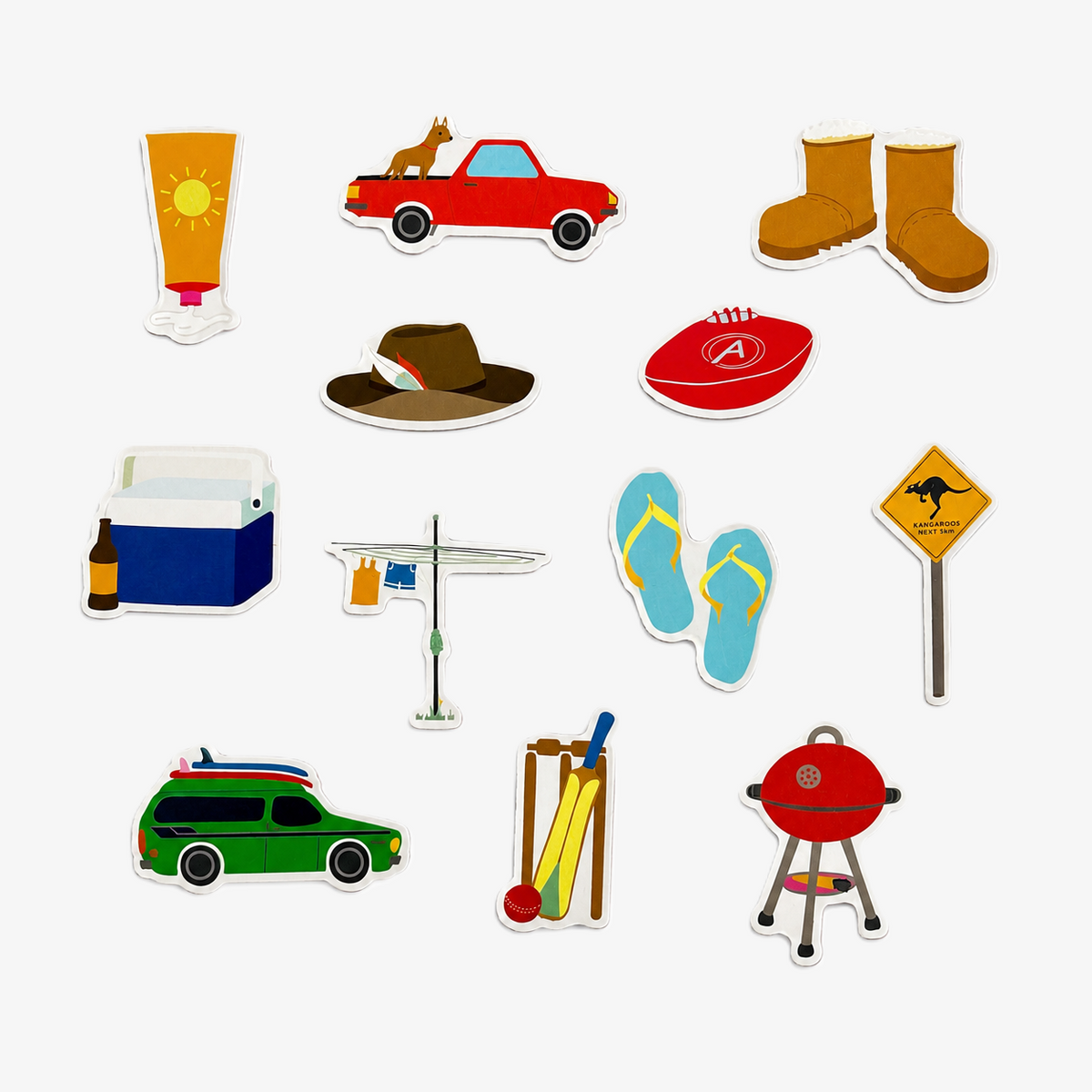 Australian icons fridge magnet set featuring a ute, Hills Hoist, thongs, cricket, BBQ, footy, Akubra-style hat, boots, sunscreen and Esky.