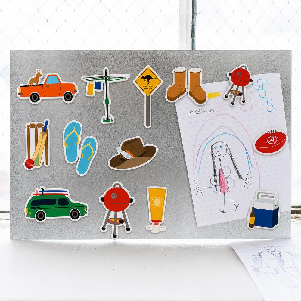 Australian icons fridge magnet set featuring a ute, Hills Hoist, thongs, cricket, BBQ, footy, Akubra-style hat, boots, sunscreen and Esky.