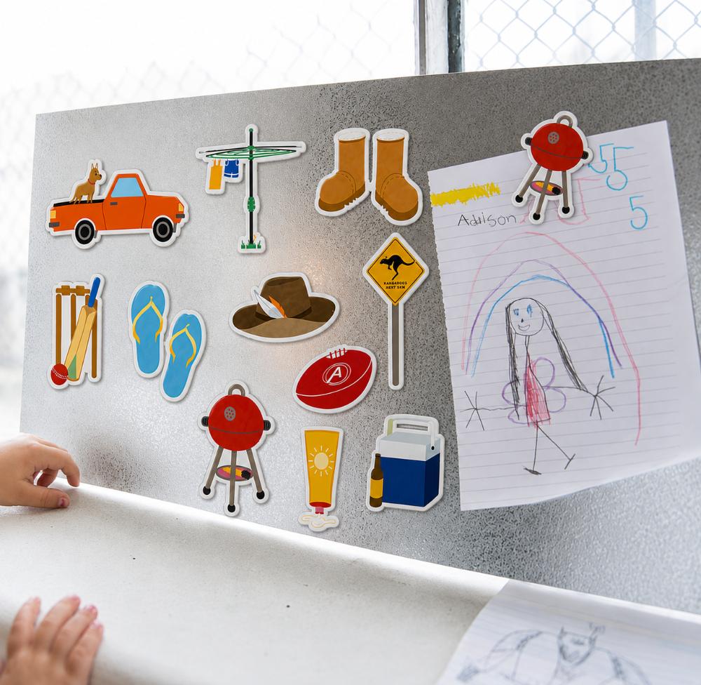 Australian icons fridge magnet set featuring a ute, Hills Hoist, thongs, cricket, BBQ, footy, Akubra-style hat, boots, sunscreen and Esky.