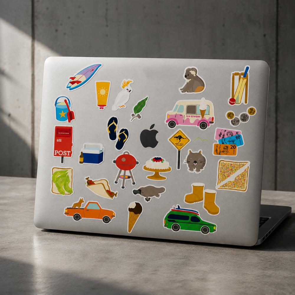 Two-sheet Aussie Icons Sticker Set in clear retail packaging featuring colourful Australian icons including Fairy Bread, kangaroo, koala, ute, BBQ, pavlova, post box, beach gear, ice cream van, cricket, thongs, coins and other nostalgic Australian favourites.
