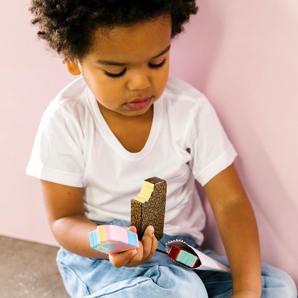 Wooden toy ice cream set with Bubble O’ Bill, Golden Gaytime, Mint Choc Wedge, Rainbow Paddle Pop, wooden stand and paper bags for pretend play.