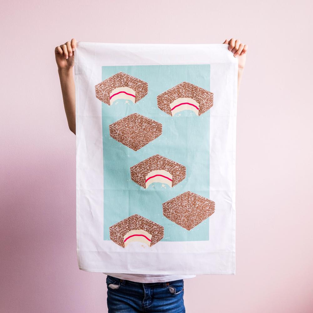 Australian Lamington Tea Towel featuring a bold retro design, 100% cotton kitchen towel celebrating classic Aussie desserts and nostalgic treats.