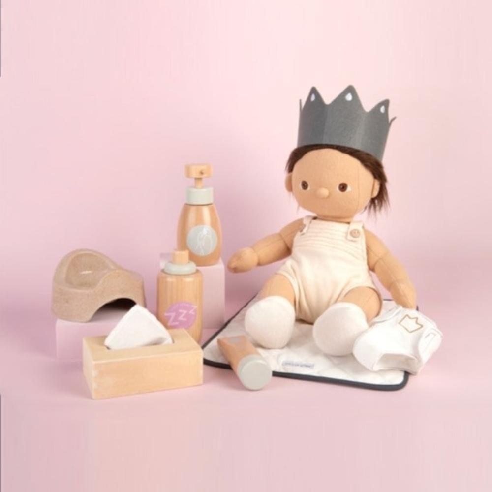 Wooden toy Doll Nurturing Kit made of wood and fabric for kids with potty, wipes, nappies, and accessories designed for pretend play, nurturing, and hands-on role-play activities.