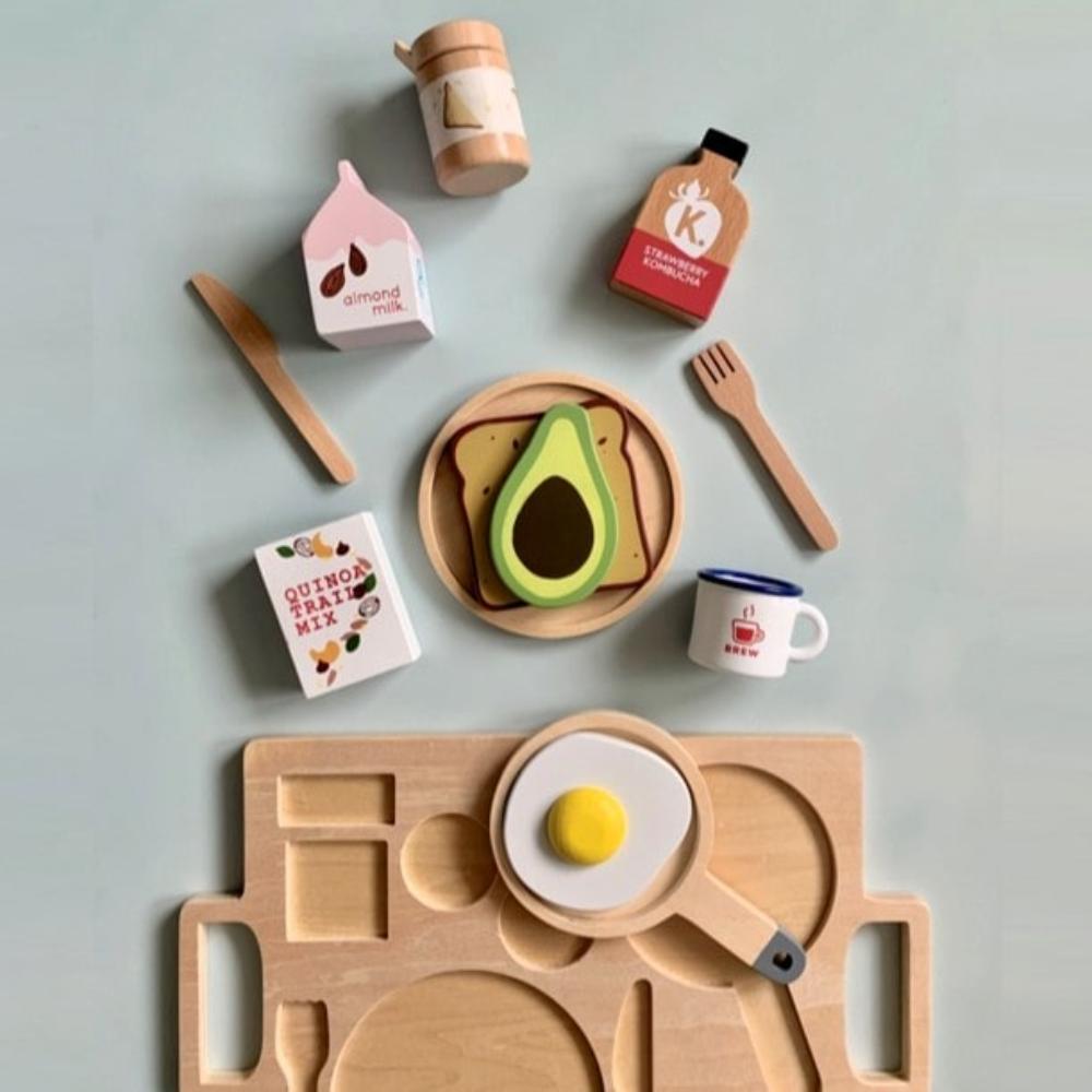 Make Me Iconic wooden Healthy Tummy Brekkie or Breakfast Tray featuring toy avocado toast, kombucha, almond milk, goat's cheese, and tahini spread. A 21-piece wooden breakfast play set inspired by Aussie café culture, perfect for pretend play, creativity, and healthy food learning.