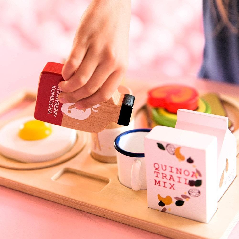 Make Me Iconic wooden Healthy Tummy Brekkie or Breakfast Tray featuring toy avocado toast, kombucha, almond milk, goat's cheese, and tahini spread. A 21-piece wooden breakfast play set inspired by Aussie café culture, perfect for pretend play, creativity, and healthy food learning.