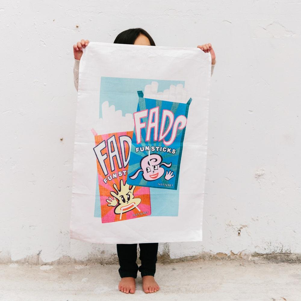 Retro Fads Fun Sticks tea towel made from 100% cotton, featuring nostalgic Australian candy design, perfect for gifting, kitchen décor, and Aussie souvenirs.