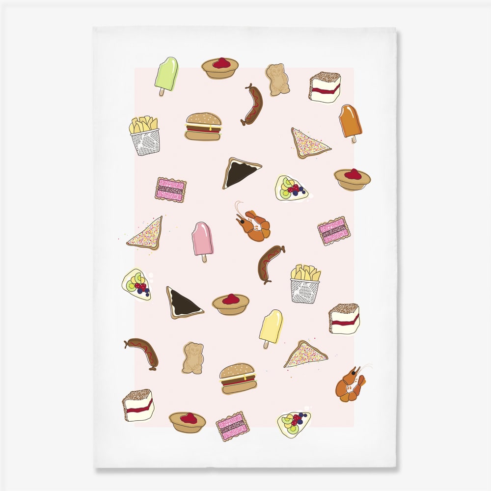 Make Me Iconic tea towel featuring iconic Australian foods, such as Vegemite toast, fairy bread, meat pies, pavlova, and lamingtons. A colourful, quirky kitchen accessory celebrating Aussie culture and nostalgia