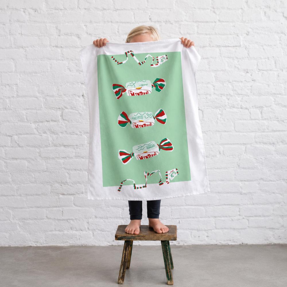 Iconic Minties Tea Towel featuring Australia's famous chewy Minties wrappers and the classic wrapper-tearing game that generations of Aussies remember.