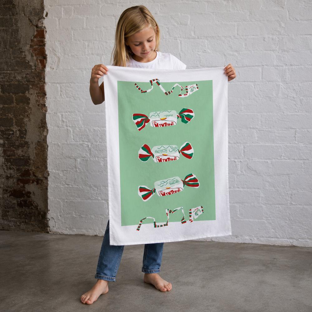 Iconic Minties Tea Towel featuring Australia's famous chewy Minties wrappers and the classic wrapper-tearing game that generations of Aussies remember.