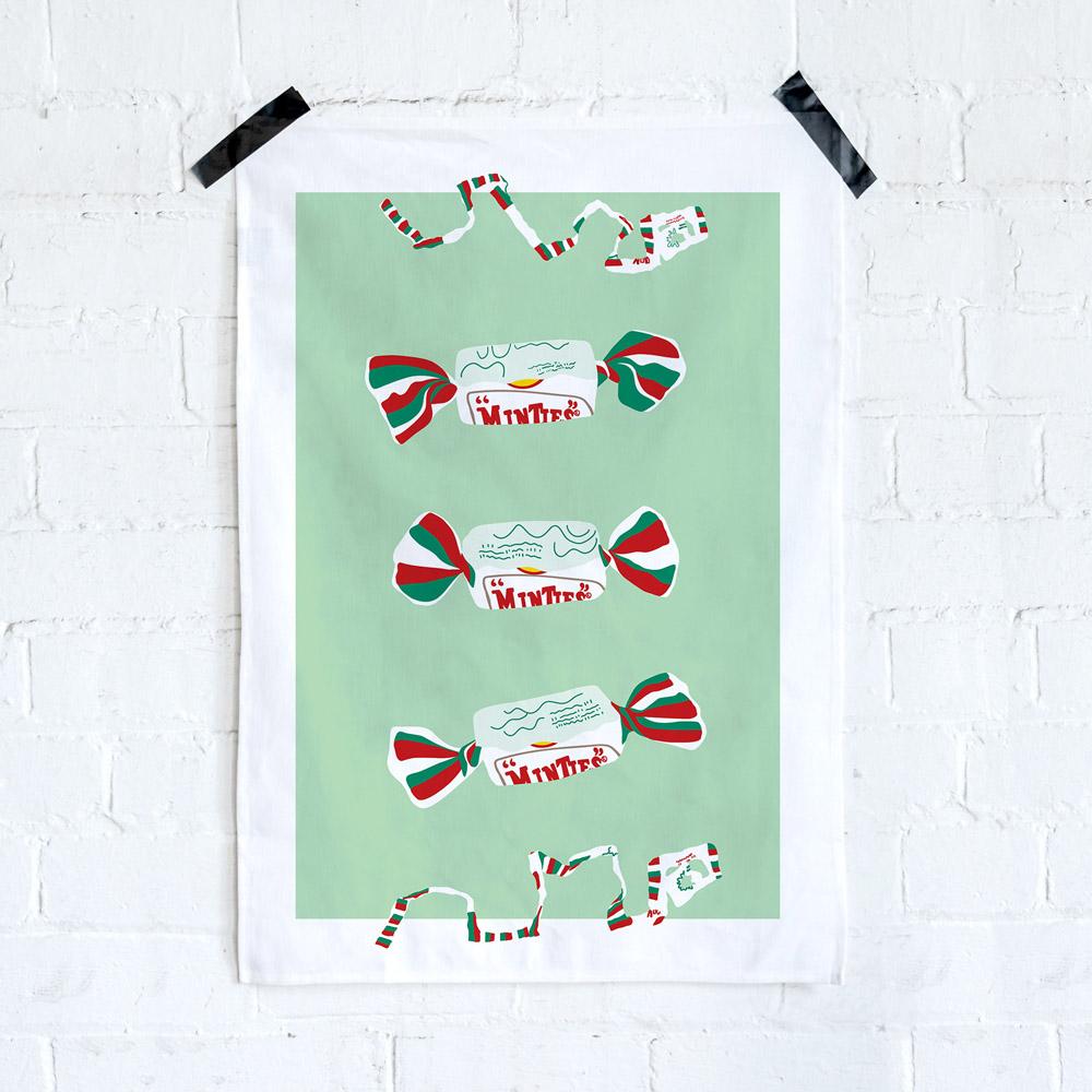 Iconic Minties Tea Towel featuring Australia's famous chewy Minties wrappers and the classic wrapper-tearing game that generations of Aussies remember.