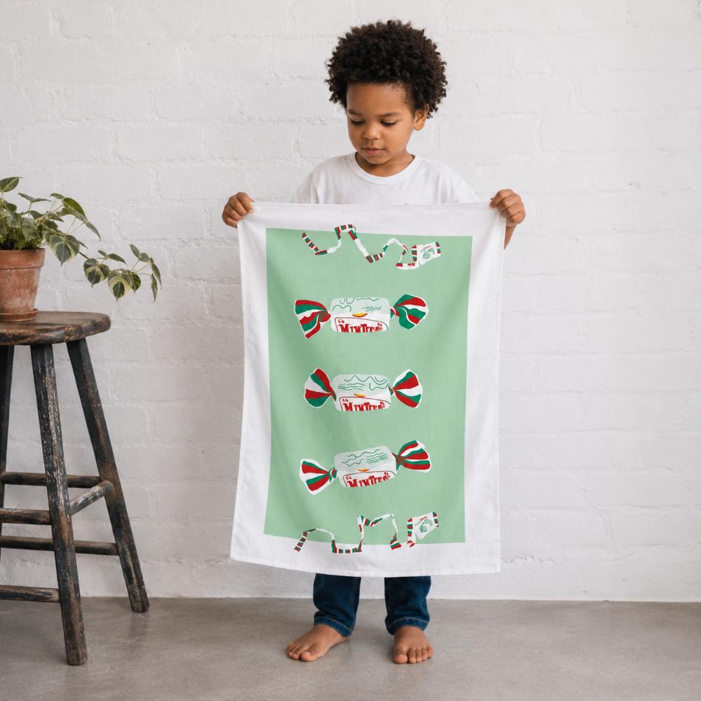 Iconic Minties Tea Towel featuring Australia's famous chewy Minties wrappers and the classic wrapper-tearing game that generations of Aussies remember.