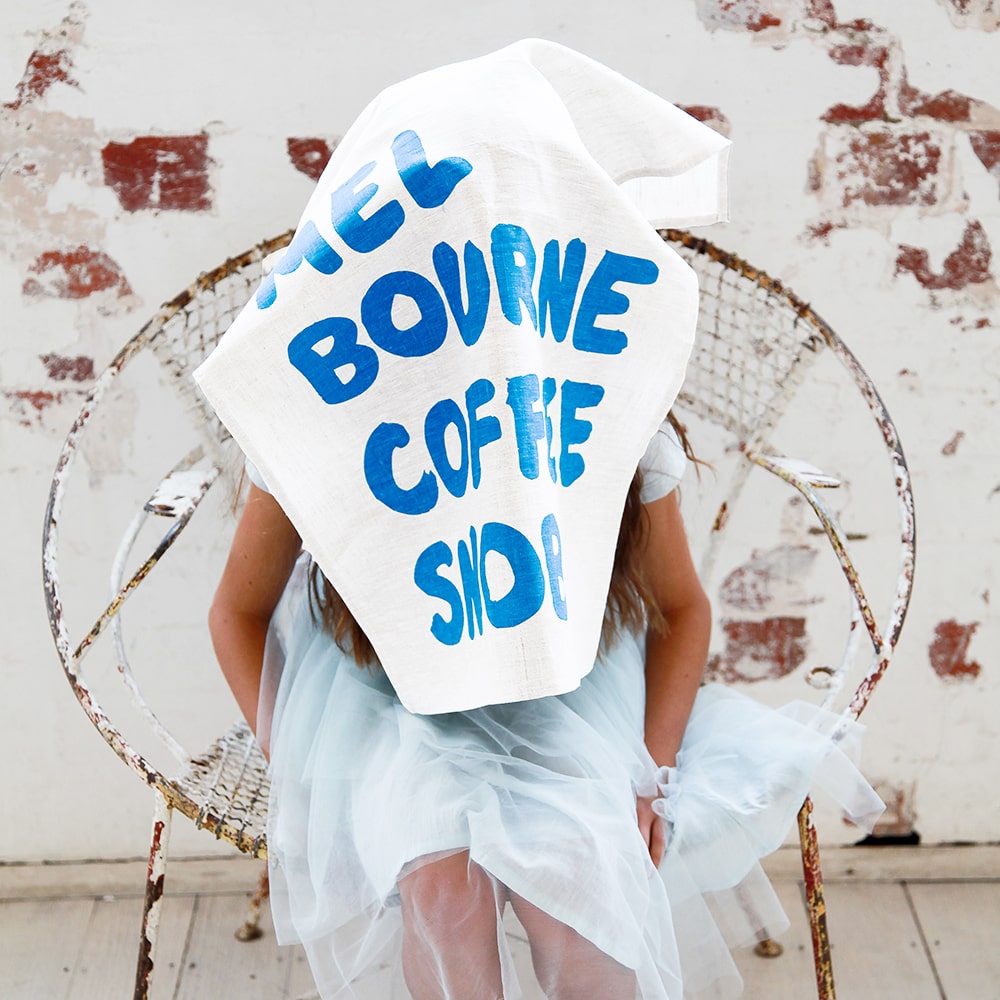 Make Me Iconic Coffee Snob Tea Towel celebrating Melbourne’s coffee culture, as featured by Kylie Minogue on Instagram, perfect for caffeine lovers and city pride.