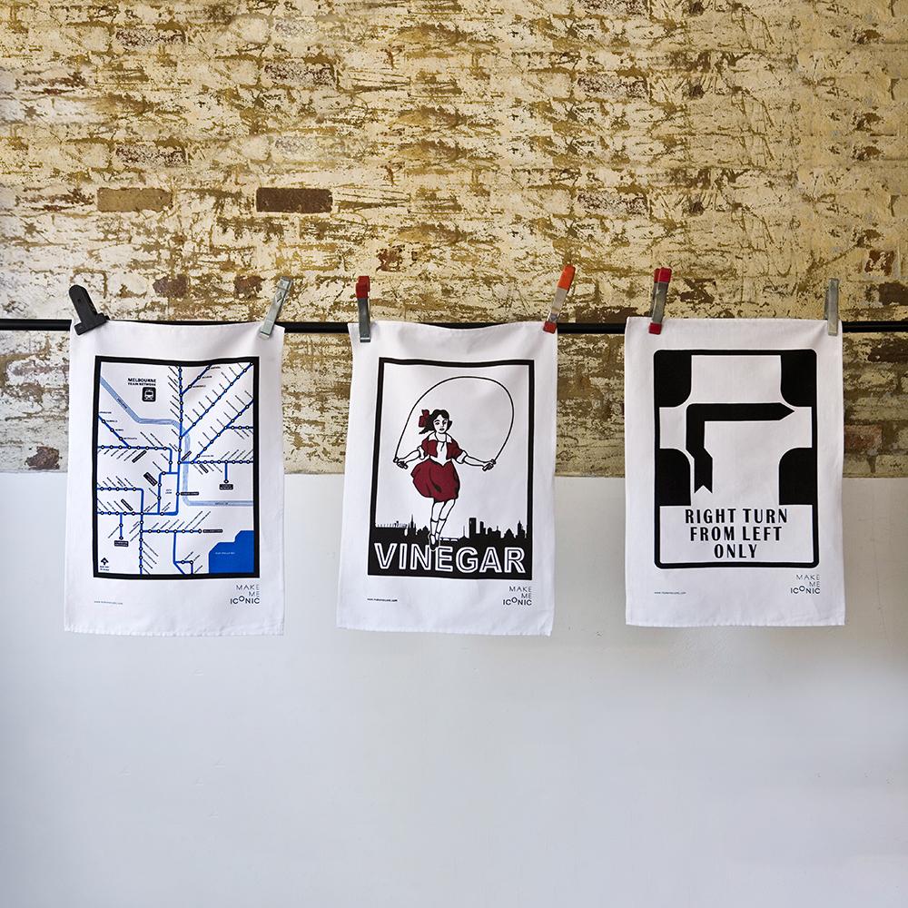 Make Me Iconic’ Melbourne Hook Turn Tea Towel featuring the iconic "Right Turn from Left Only" road sign in bold black and white. A playful nod to Melbourne’s famously confusing driving rule, printed on a cotton-linen blend towel perfect for kitchens, gifts, or nostalgic decor.