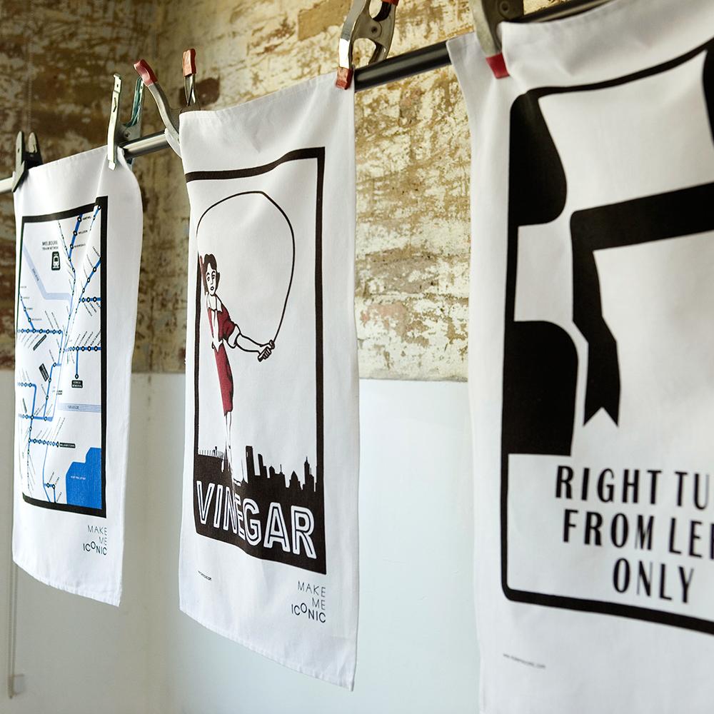 Make Me Iconic’ Melbourne Hook Turn Tea Towel featuring the iconic "Right Turn from Left Only" road sign in bold black and white. A playful nod to Melbourne’s famously confusing driving rule, printed on a cotton-linen blend towel perfect for kitchens, gifts, or nostalgic decor.