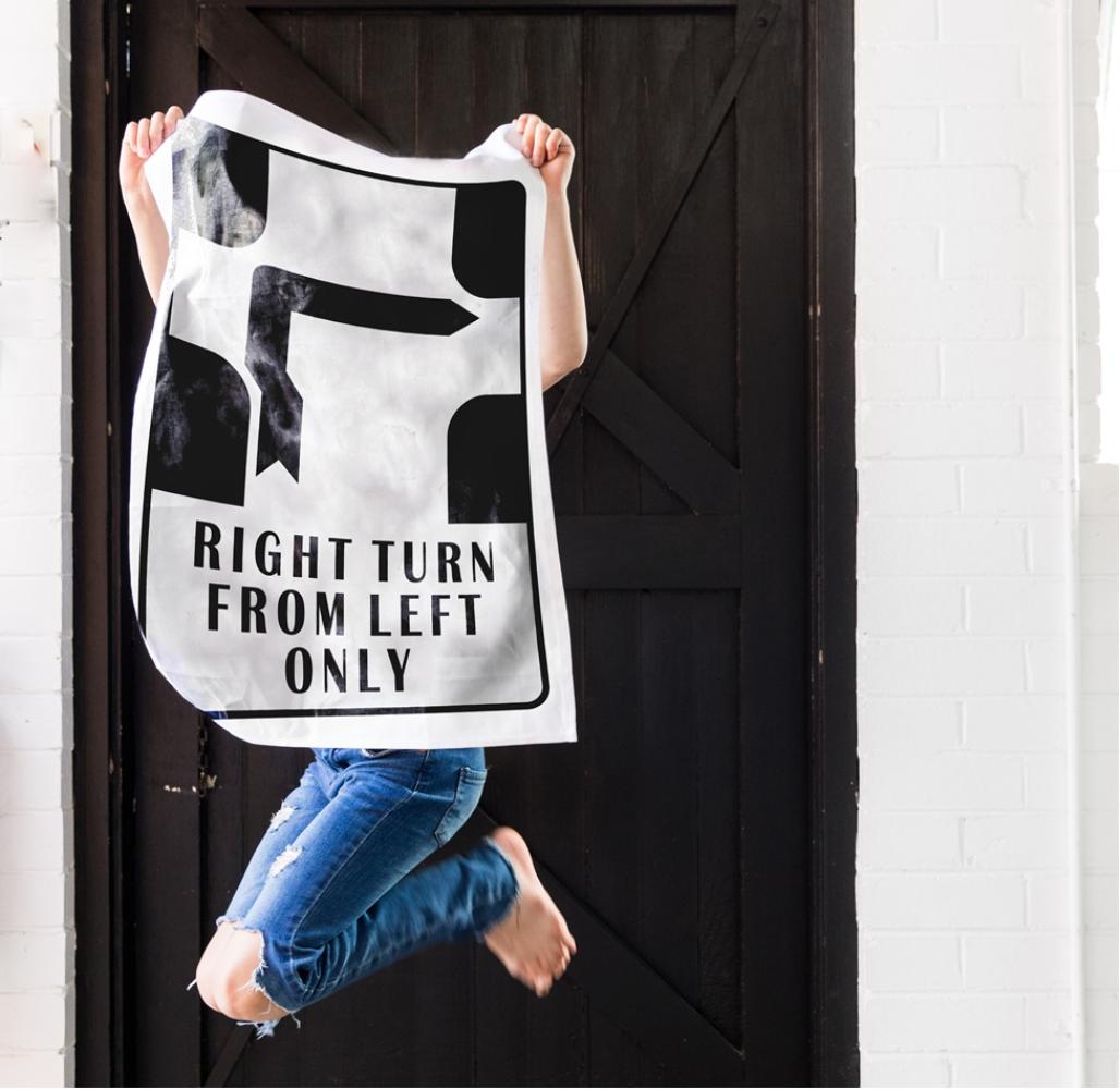 Make Me Iconic’ Melbourne Hook Turn Tea Towel featuring the iconic "Right Turn from Left Only" road sign in bold black and white. A playful nod to Melbourne’s famously confusing driving rule, printed on a cotton-linen blend towel perfect for kitchens, gifts, or nostalgic decor.