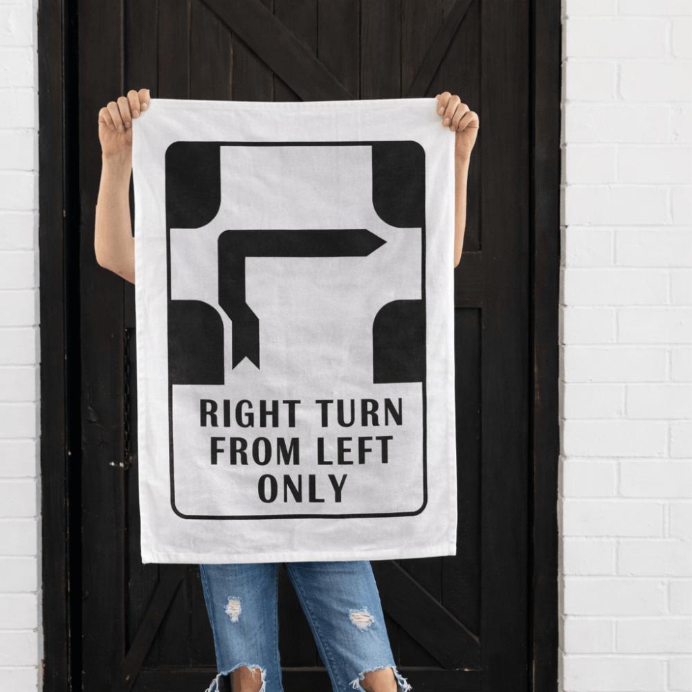 Make Me Iconic’ Melbourne Hook Turn Tea Towel featuring the iconic "Right Turn from Left Only" road sign in bold black and white. A playful nod to Melbourne’s famously confusing driving rule, printed on a cotton-linen blend towel perfect for kitchens, gifts, or nostalgic decor.