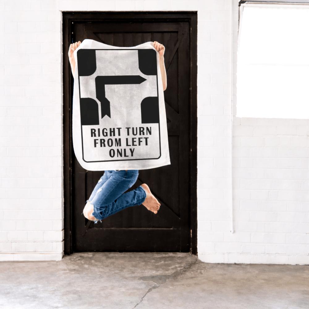Make Me Iconic’ Melbourne Hook Turn Tea Towel featuring the iconic "Right Turn from Left Only" road sign in bold black and white. A playful nod to Melbourne’s famously confusing driving rule, printed on a cotton-linen blend towel perfect for kitchens, gifts, or nostalgic decor.