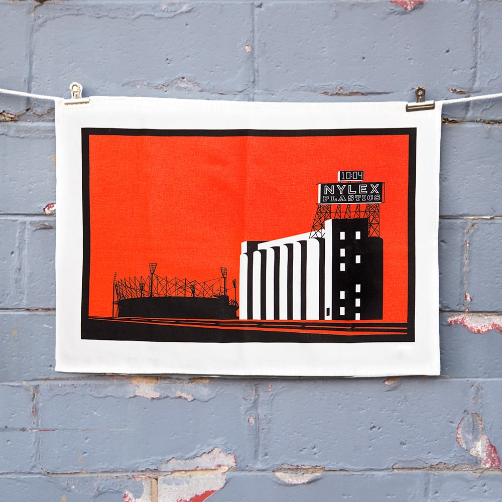 Make Me Iconic Nylex Tea Towel featuring Melbourne’s iconic rooftop sign, a tribute to vintage industrial charm and classic Aussie design.