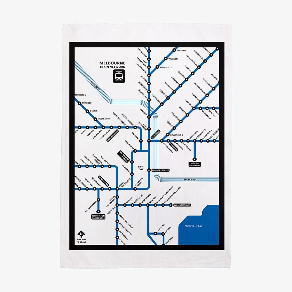 Make Me Iconic Melbourne Train Network Tea Towel featuring an illustrated map of Melbourne’s railway system, an Australian souvenir celebrating iconic public transport.