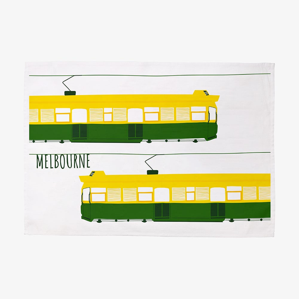 Make Me Iconic Melbourne Tram Tea Towel featuring the classic green and gold W-Class tram with vintage destination banner, an iconic Australian gift and kitchen textile.