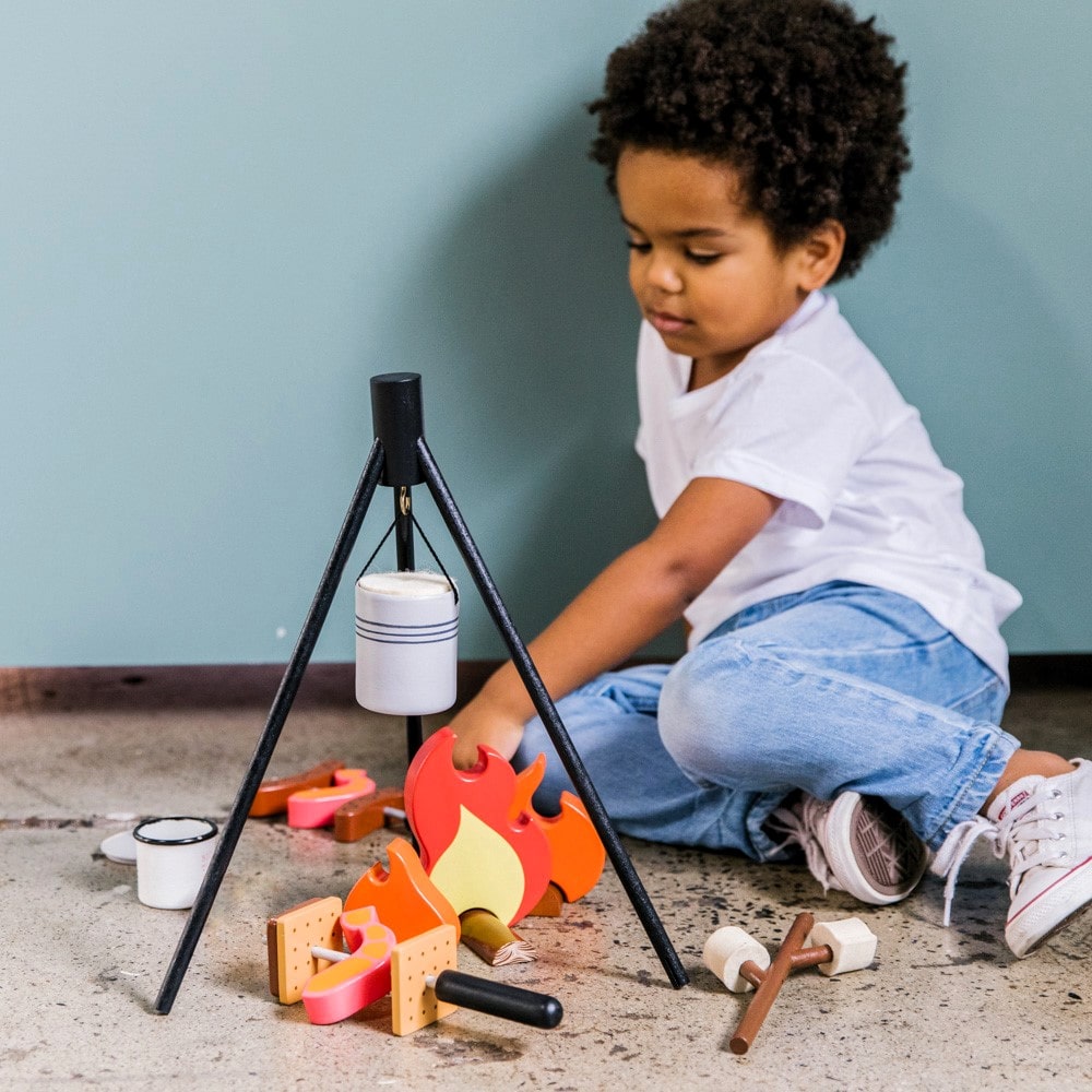 Wooden Camp Fire toy set for kids with tripod, billy can, sausages, prawns, logs, and marshmallows designed for imaginative indoor camping and pretend play