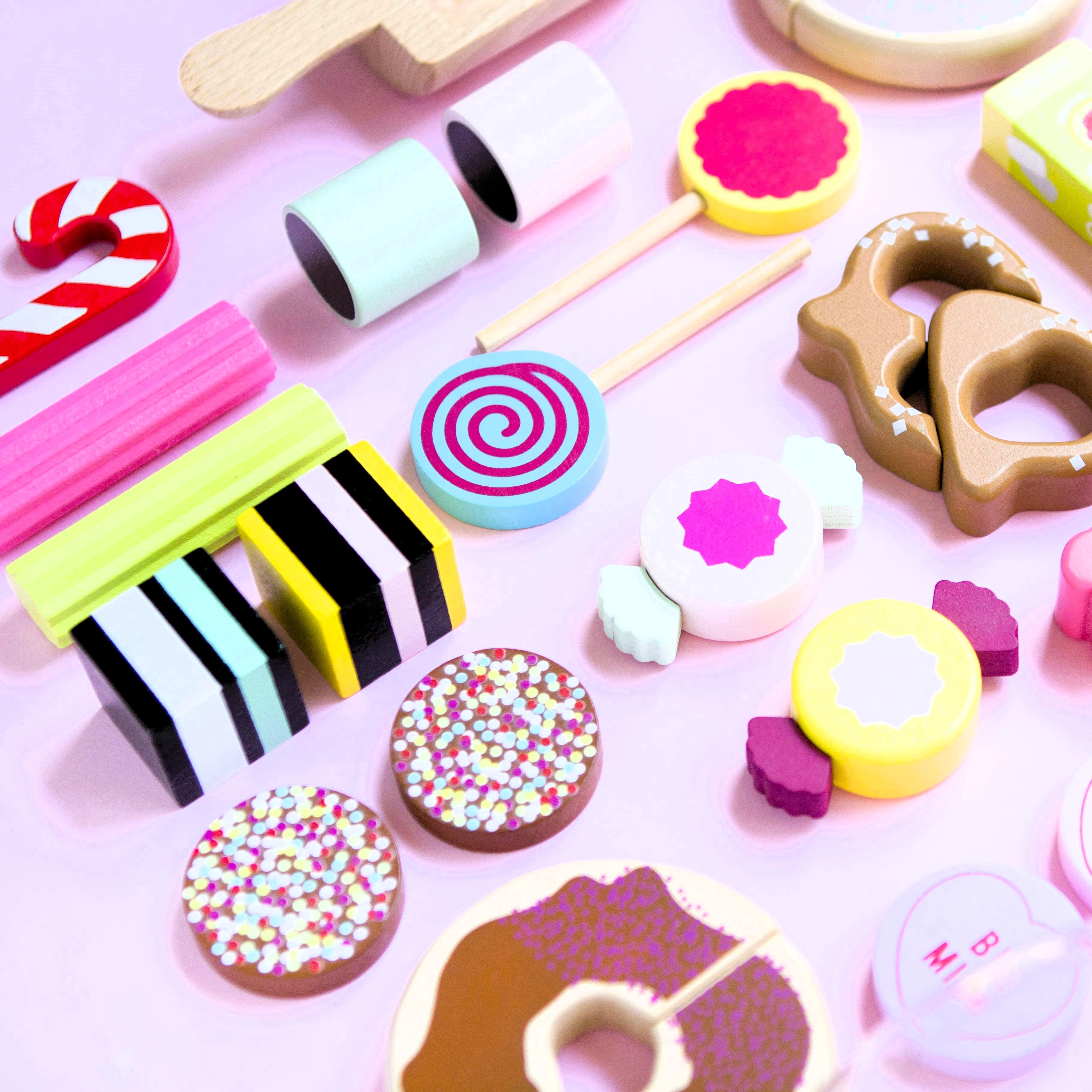 Wooden candy jar toy set for kids featuring hand-painted lollies, candy canes and wrapped sweets in an acrylic jar designed for imaginative pretend play.