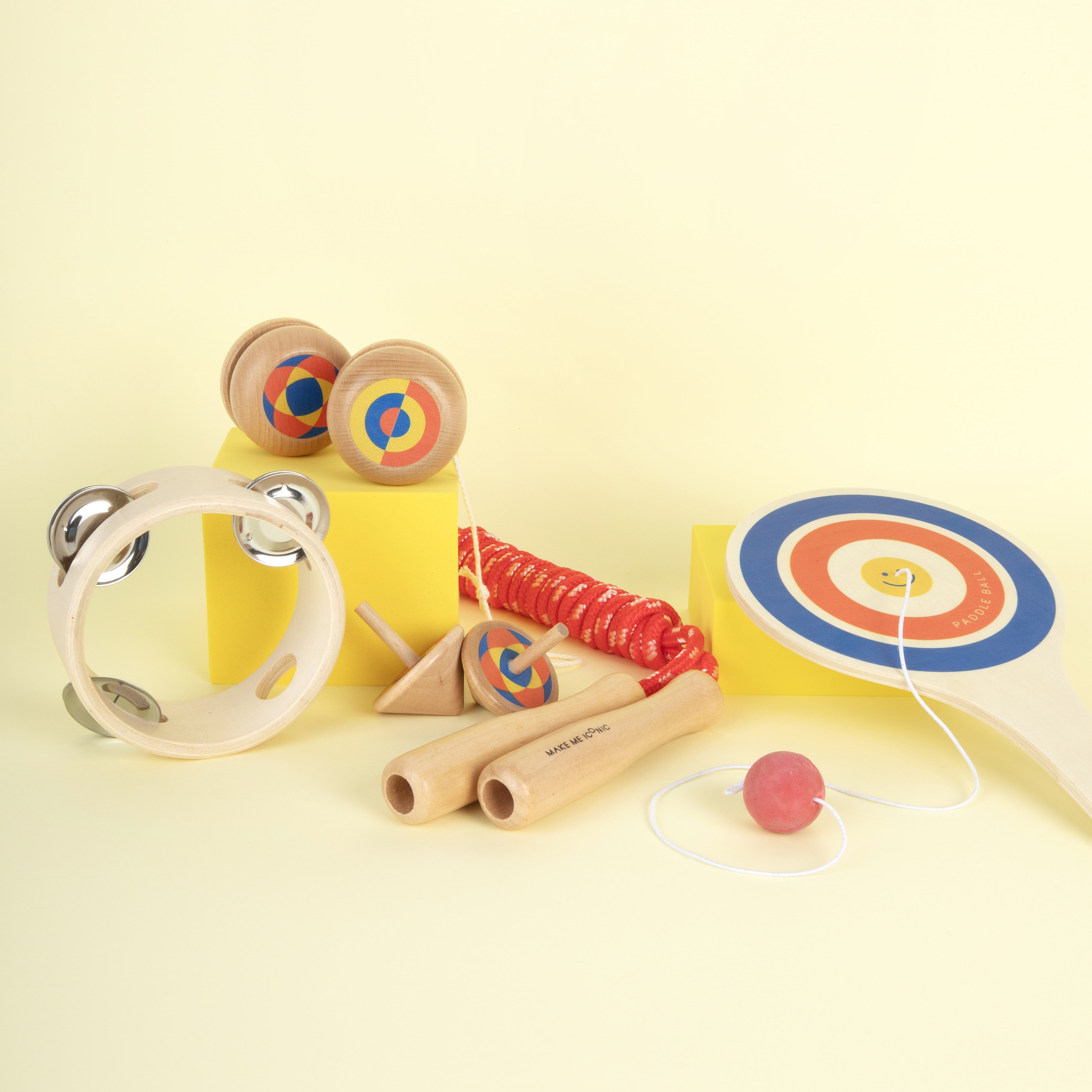 Wooden paddle ball toy with elastic rubber ball, designed for solo play and developing hand-eye coordination. A classic retro toy perfect for travel, parties, or active play at home.