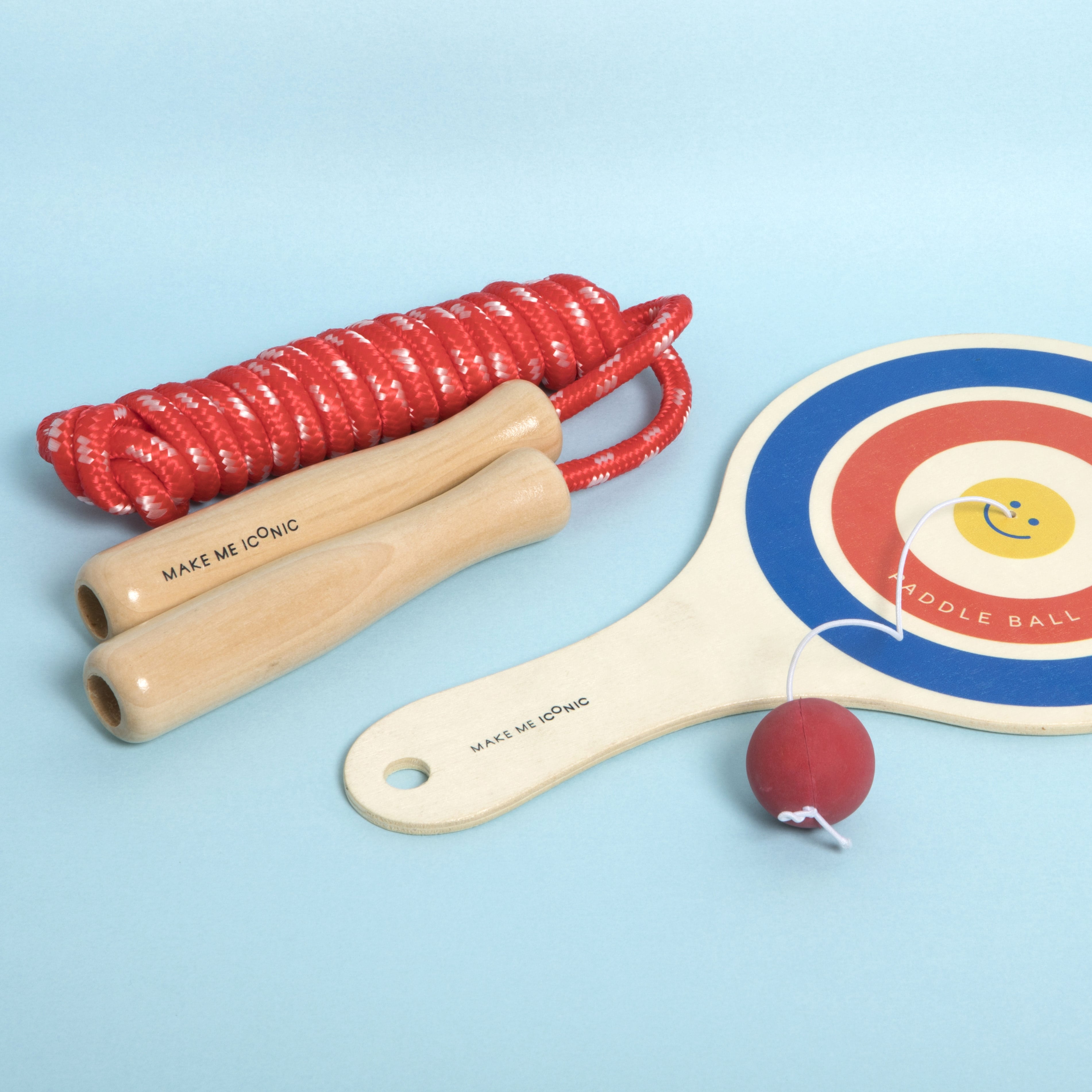 Wooden paddle ball toy with elastic rubber ball, designed for solo play and developing hand-eye coordination. A classic retro toy perfect for travel, parties, or active play at home.