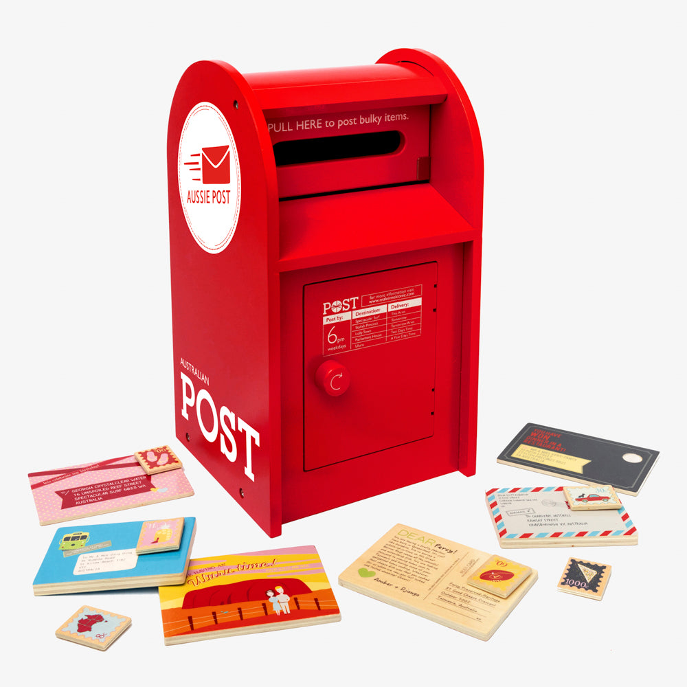 Australian Post Box wooden toy featuring a working mail slot, wooden letters, postcards and stamps. A nostalgic role-play toy inspired by the iconic red Australia Post Box.