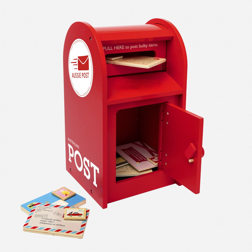 Australian Post Box wooden toy featuring a working mail slot, wooden letters, postcards and stamps. A nostalgic role-play toy inspired by the iconic red Australia Post Box.