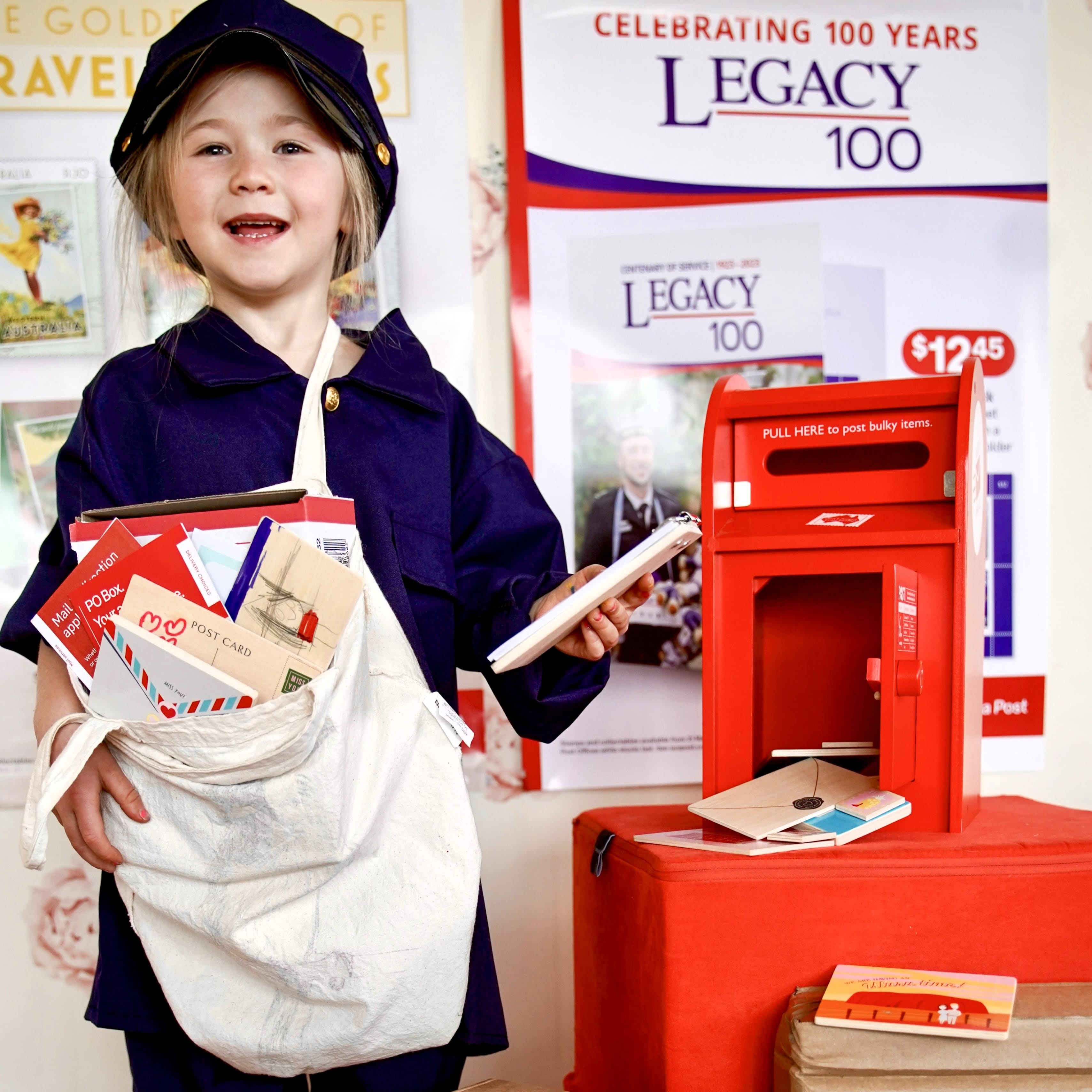 Wooden Australian post box toy with working mail slot, 6 wooden letters, and 6 Velcro stamps perfect for imaginative pretend play and storytelling.