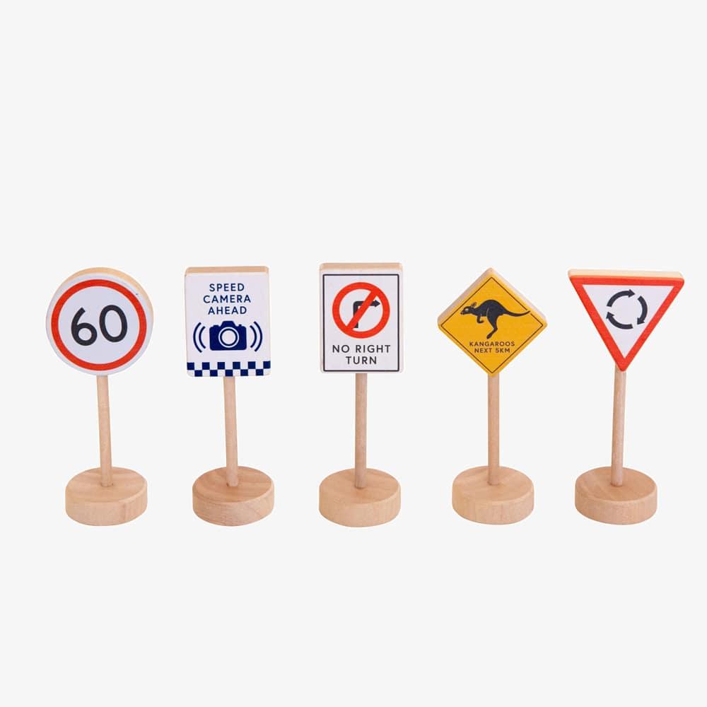 Make Me Iconic wooden Australian road sign toy set featuring 5 double-sided traffic signs with kangaroo, koala, and speed camera icons for imaginative car and city play.