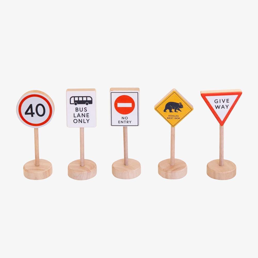 Make Me Iconic wooden Australian road sign toy set featuring 5 double-sided traffic signs with kangaroo, koala, and speed camera icons for imaginative car and city play.