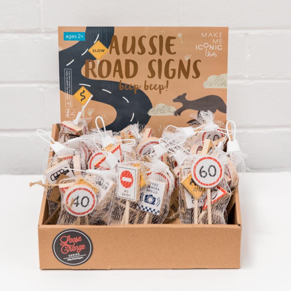 Make Me Iconic wooden Australian road sign toy set featuring 5 double-sided traffic signs with kangaroo, koala, and speed camera icons for imaginative car and city play.