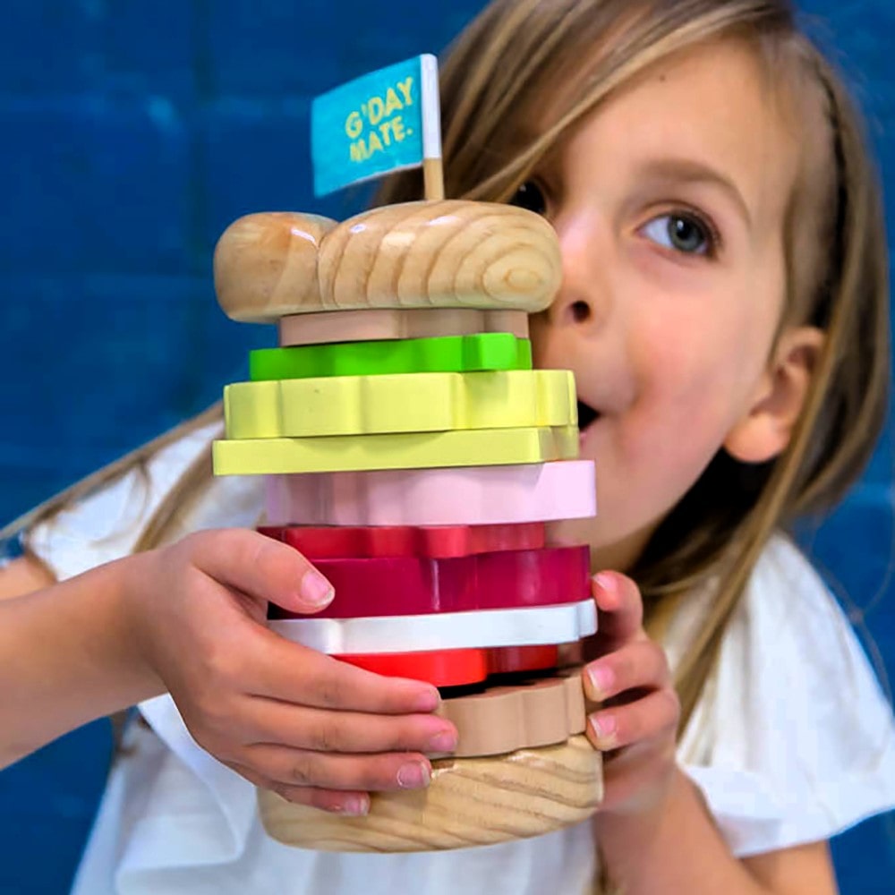 Wooden Aussie stacking burger toy for kids with colourful layers, mini flags, and chunky pieces—perfect for imaginative food play and motor skill development.