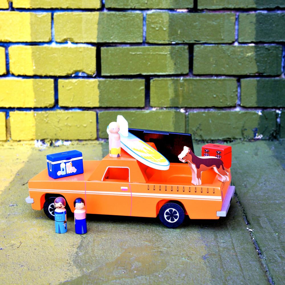 Wooden Aussie Ute toy inspired by Australia's iconic utility vehicle. Features rolling wheels, removable accessories and wooden passengers for imaginative play.