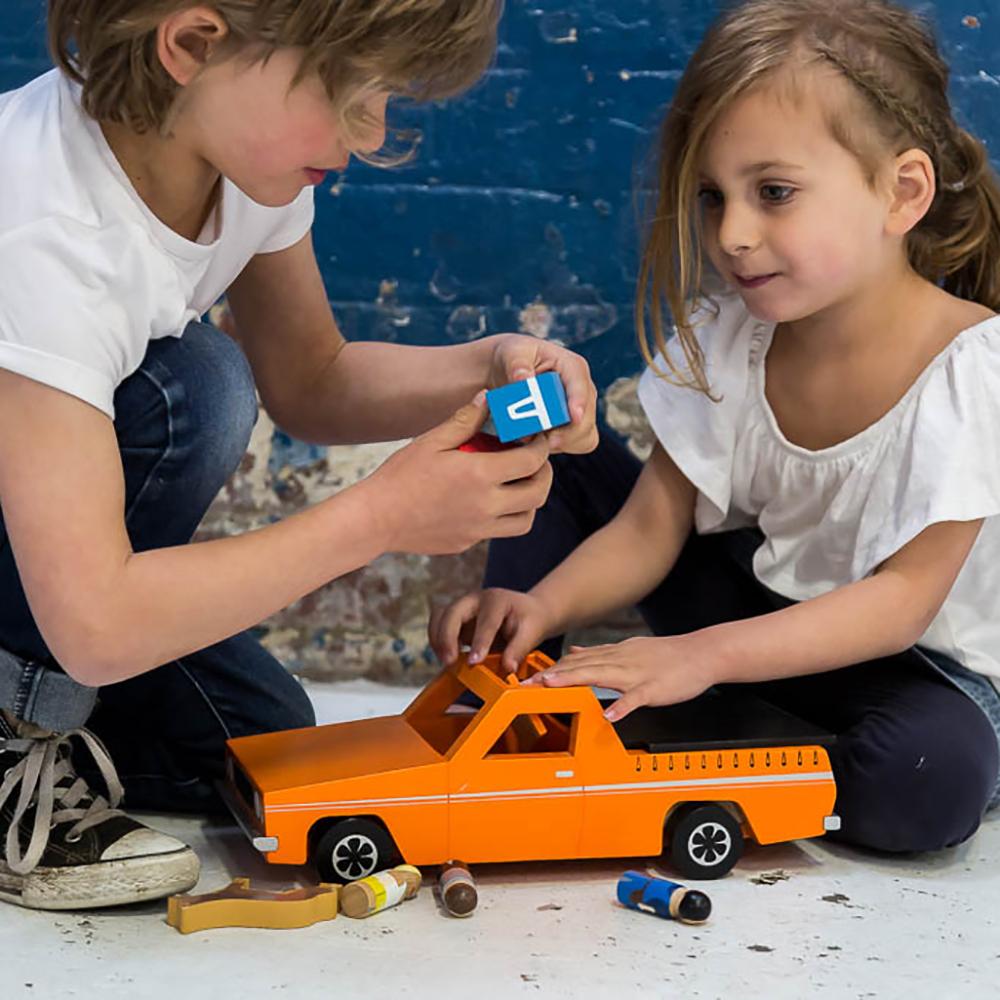 Wooden Aussie Ute toy inspired by Australia's iconic utility vehicle. Features rolling wheels, removable accessories and wooden passengers for imaginative play.