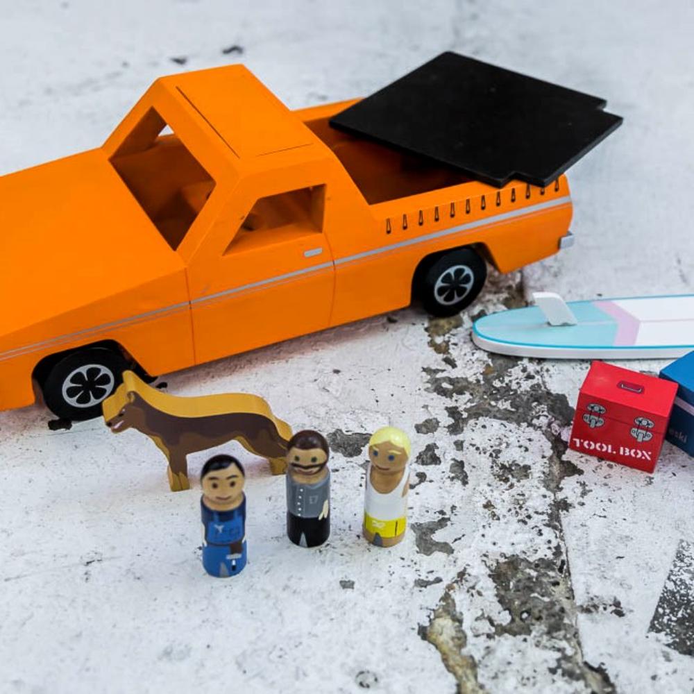 Wooden Aussie Ute toy inspired by Australia's iconic utility vehicle. Features rolling wheels, removable accessories and wooden passengers for imaginative play.