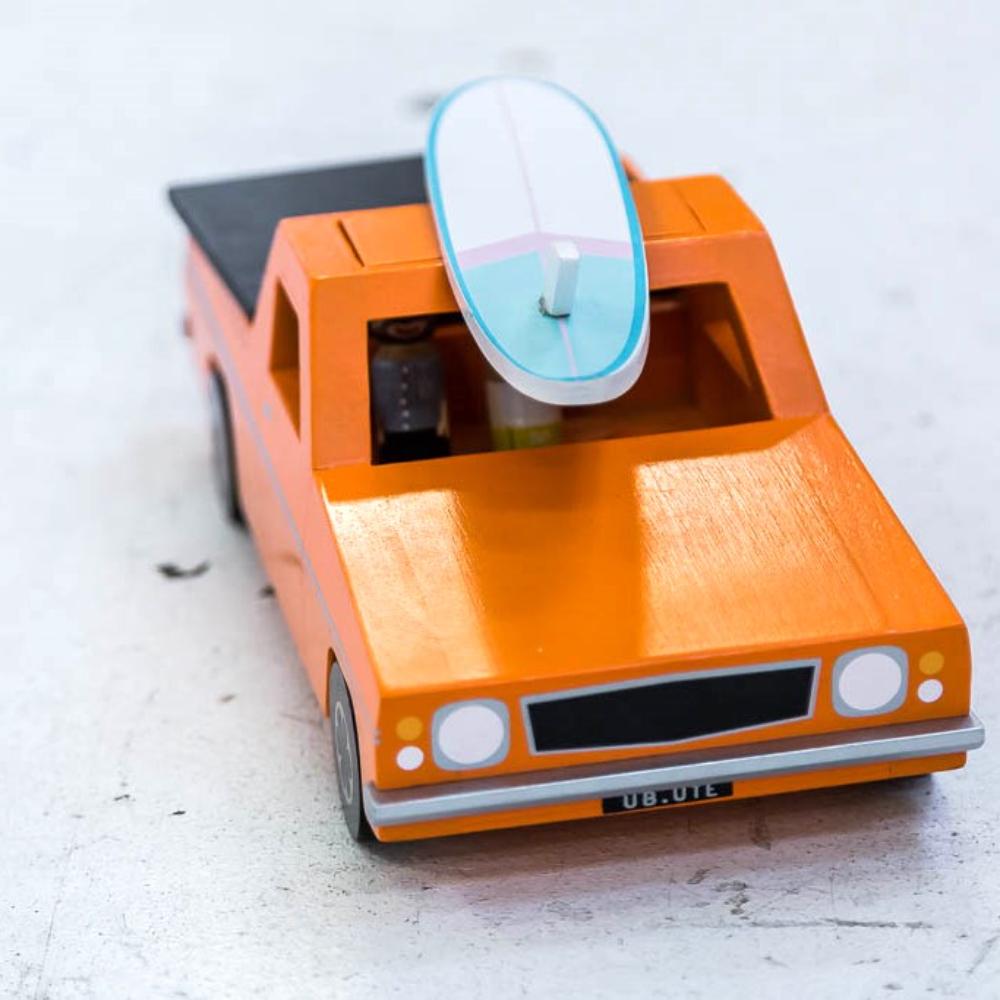 Wooden Aussie Ute toy inspired by Australia's iconic utility vehicle. Features rolling wheels, removable accessories and wooden passengers for imaginative play.