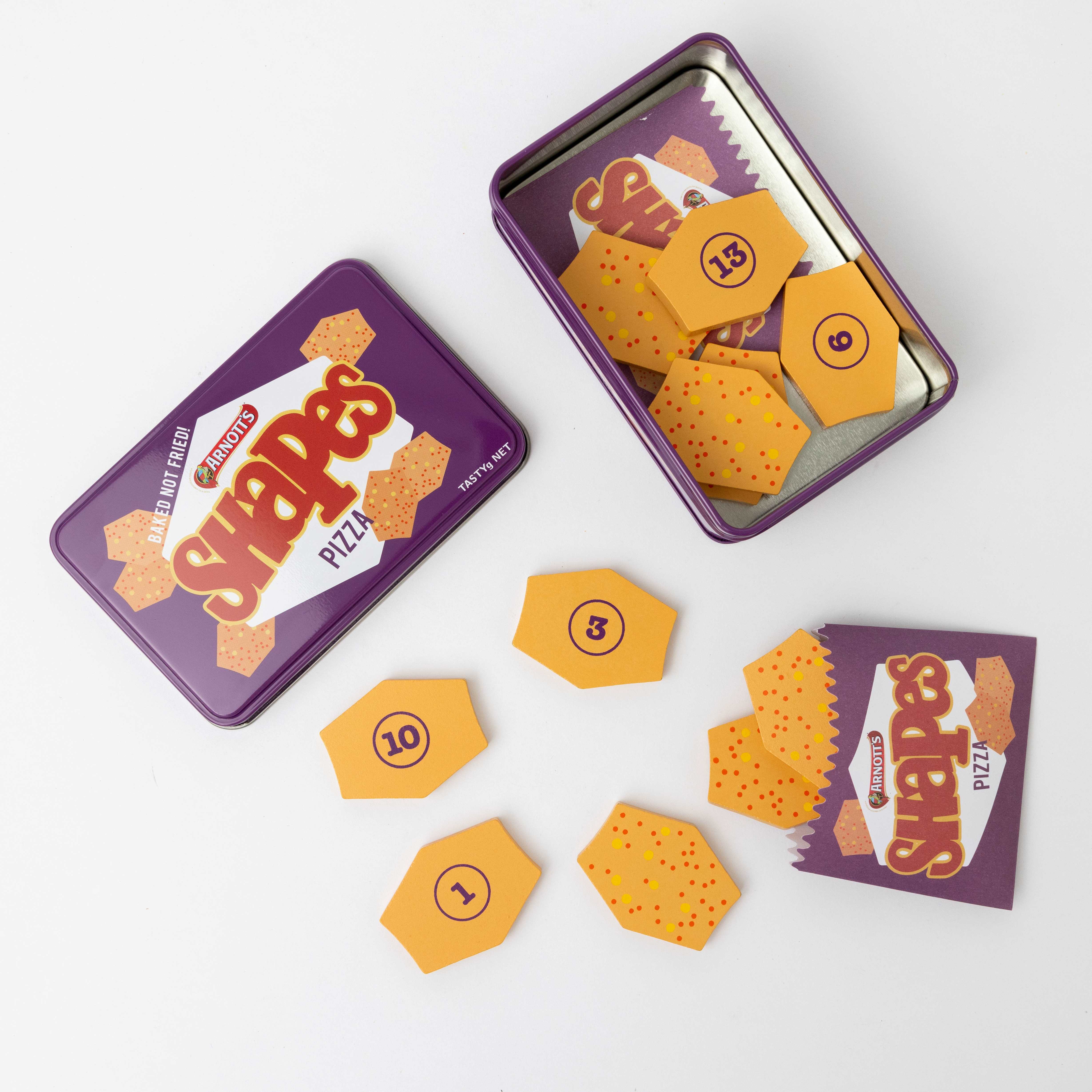 Australian Arnott’s Shapes set wooden toy with Barbecue, Pizza, and Chicken Crimpy biscuits, matching games, counting activities, and mini paper bags for pretend play.
