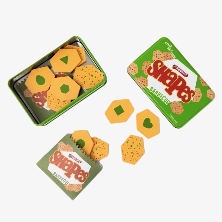 Australian Arnott’s Shapes set wooden toy with Barbecue, Pizza, and Chicken Crimpy biscuits, matching games, counting activities, and mini paper bags for pretend play.
