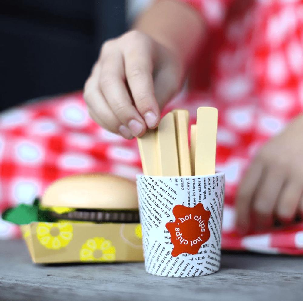 Make Me Iconic Australian wooden toy food set, 38-piece pretend play set featuring Vegemite, Fairy Bread, Pavlova, Lamington, meat pie, snag in bread, and hot Chips with sauce for imaginative kitchen play.
