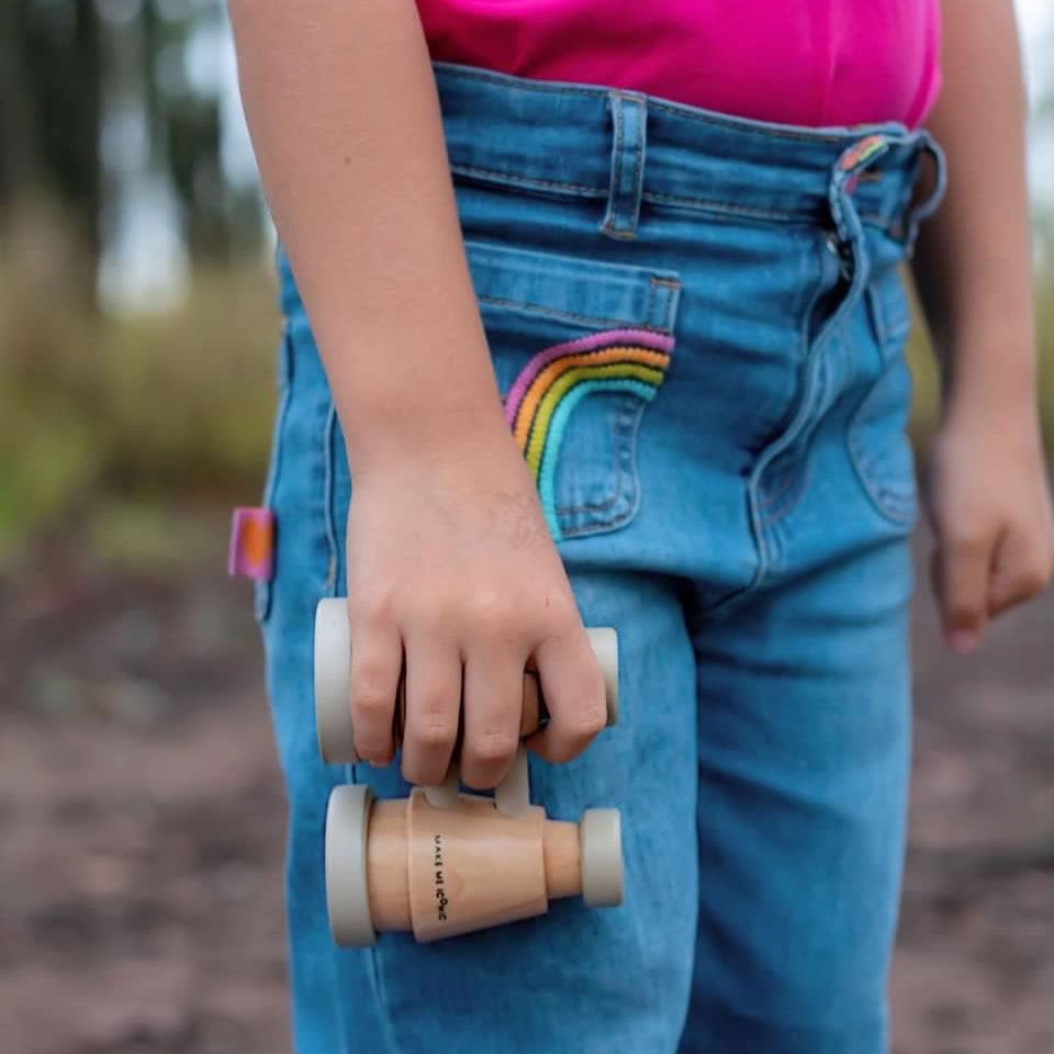 Make Me Iconic wooden toy binoculars with a smooth natural finish, perfectly sized for little hands. Ideal for pretend play adventures like pirate hunts, backyard exploration, or spy missions, encouraging creativity and role-play without screens or batteries.