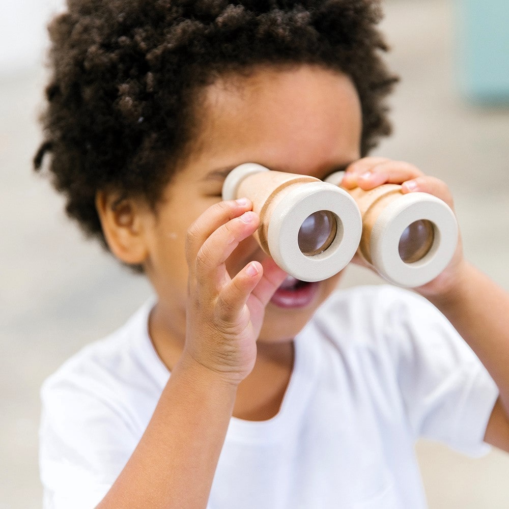 Make Me Iconic wooden toy binoculars with a smooth natural finish, perfectly sized for little hands. Ideal for pretend play adventures like pirate hunts, backyard exploration, or spy missions, encouraging creativity and role-play without screens or batteries.