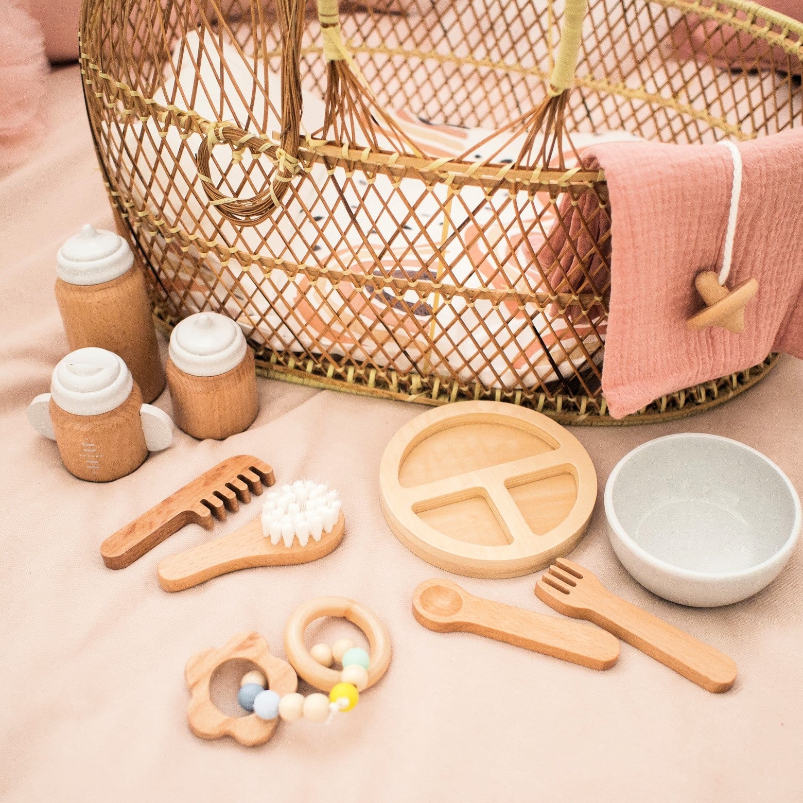 Make Me Iconic 11-piece wooden doll accessory kit with bottles, sippy cup, bowl, fork, spoon, brush with real bristles, comb, teether, and clip-on pacifier – perfect for pretend play.