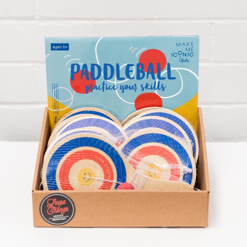 Make Me Iconic wooden paddle ball toy with elastic rubber ball, designed for solo play and developing hand-eye coordination. A classic retro toy perfect for travel, parties, or active play at home.
