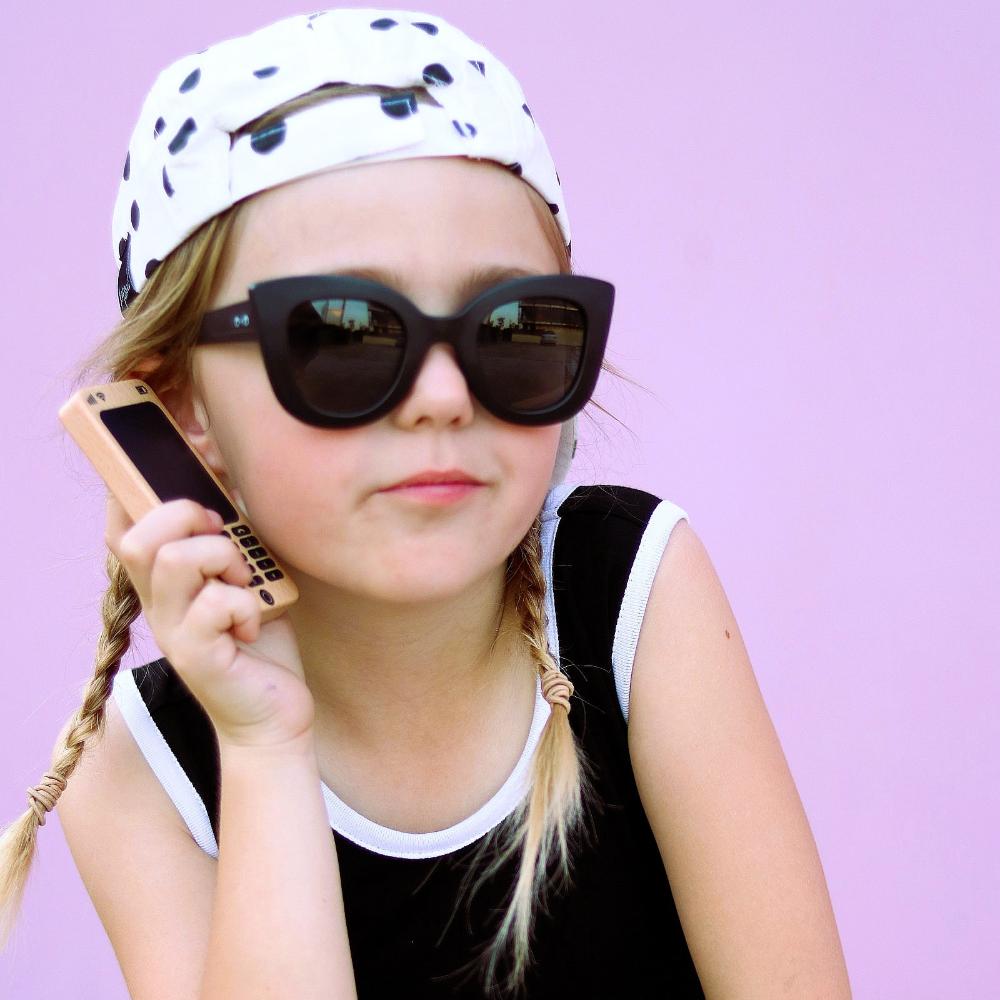 Make Me Iconic Wooden Toy Phone from the Loose Change Range, featuring a realistic design for pretend selfies, texting, and calls. Encourages imaginative, screen-free play for kids who love to copy the grown-ups.